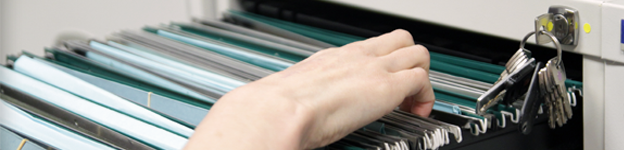 Image of some patient records in a filing cabinet